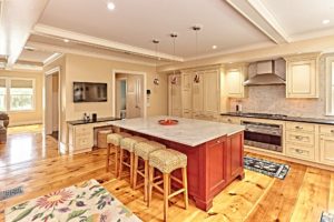 Kitchen in a 2-story colonial style luxury home in East Sandwich, MA.