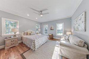 Image of the master bedroom in a 2-story colonial style home in East Dennis, MA.
