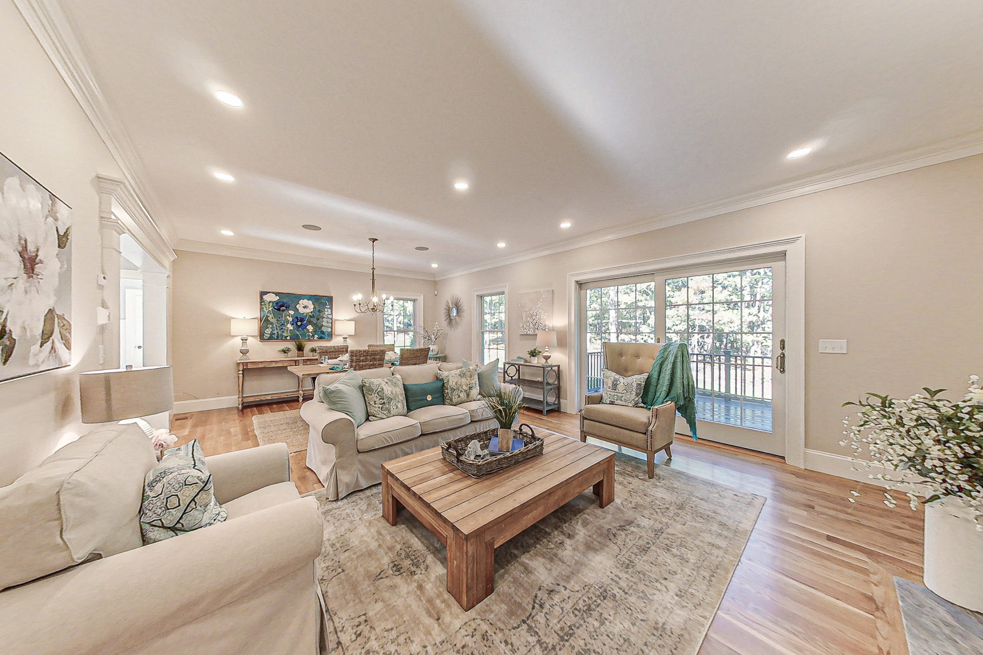 Image of a staged living room and dining room showing how real estate photography can capture your home’s beauty and value